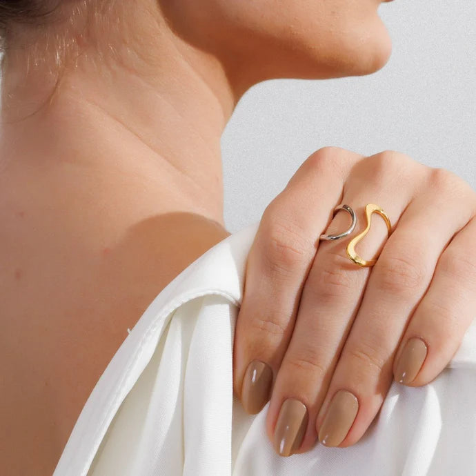 Adjustable contour ring with a mix of gold and silver plating.